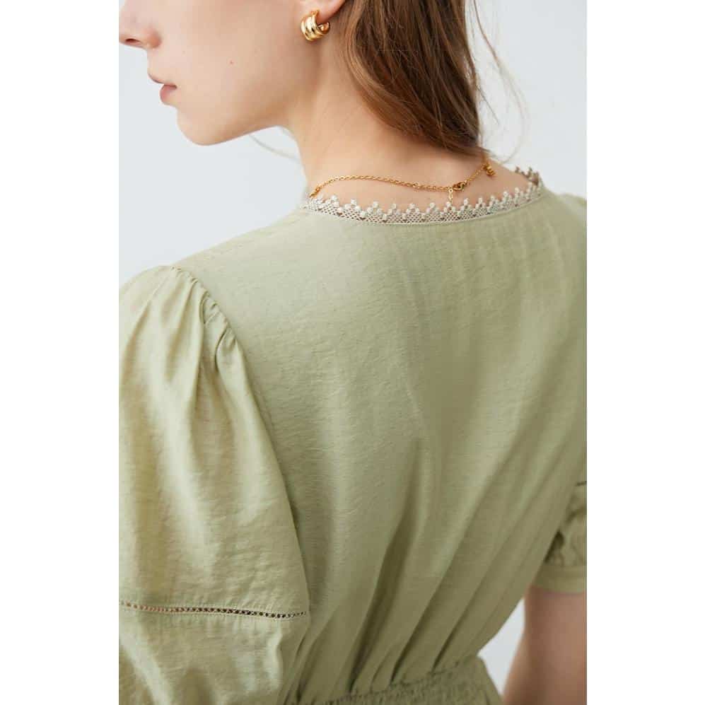 Close-up of a woman wearing a delicate gold chain necklace and matching gold earrings, showcasing premium jewelry from Monalisa Store. Perfect for stylish accessorizing and gift ideas.