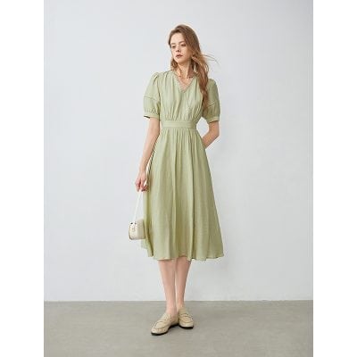 Light green midi dress with puff sleeves, V-neck, and cinched waist, perfect for summer and casual outings. Versatile fashion piece from Monalisa Store.