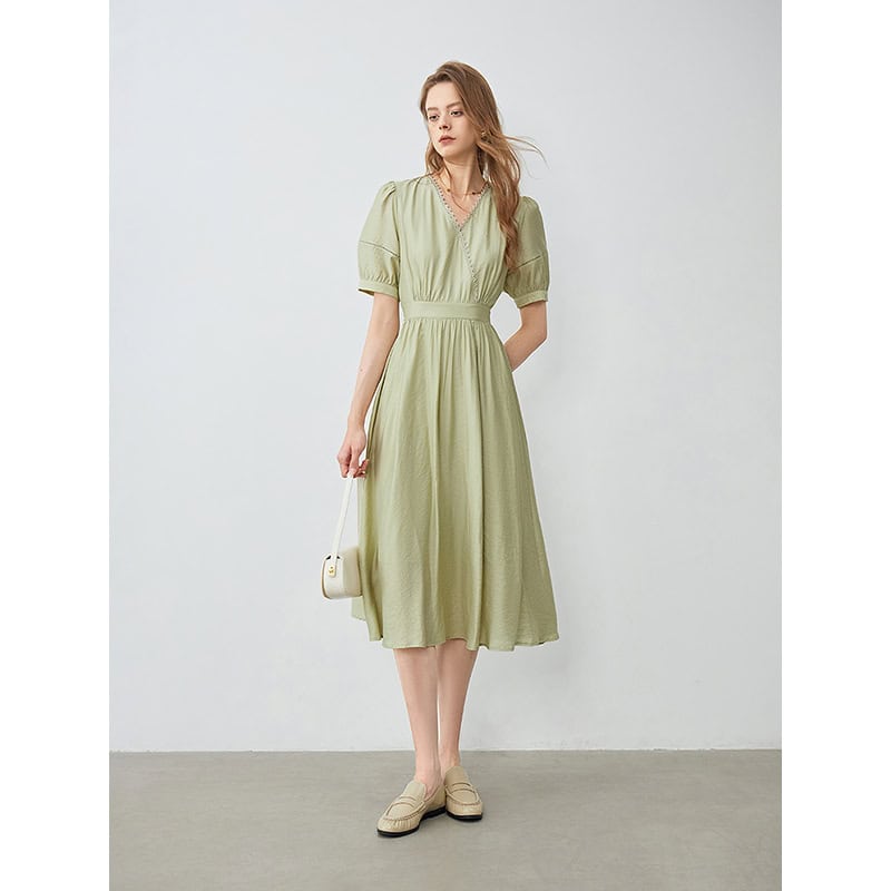 Light green midi dress with puff sleeves, V-neck, and cinched waist, perfect for summer and casual outings. Versatile fashion piece from Monalisa Store.
