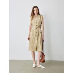 Light beige sleeveless linen dress with button closure and waist belt, ideal for warm weather. Casual yet chic style for everyday wear or outings.