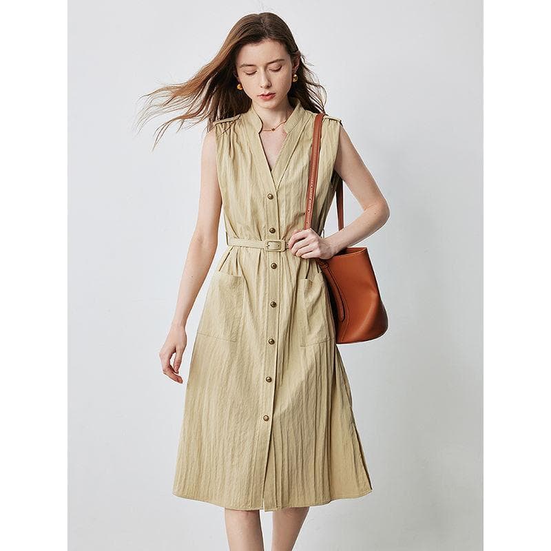 Beige sleeveless midi dress with buttons and waist belt, perfect for casual or office wear, offering a chic and comfortable look for women.