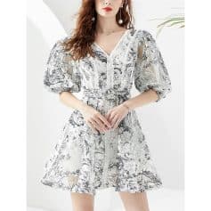 Elegant floral dress with puff sleeves, V-neck, and ruffled hem ideal for stylish occasions and summer wear.