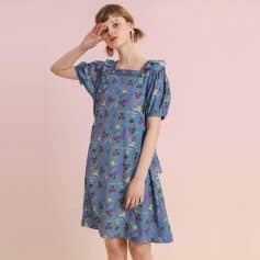 A stylish blue dress with playful, colorful print, featuring puffy sleeves and a comfortable fit, perfect for casual outings and daily wear at Monalisa Store.