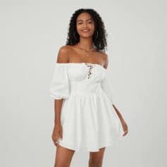 Stylish white off-shoulder dress with puff sleeves and lace-up front, perfect for summer outings and casual wear. Shop fashionable women's dresses at Monalisa Store for trendy and affordable clothing.