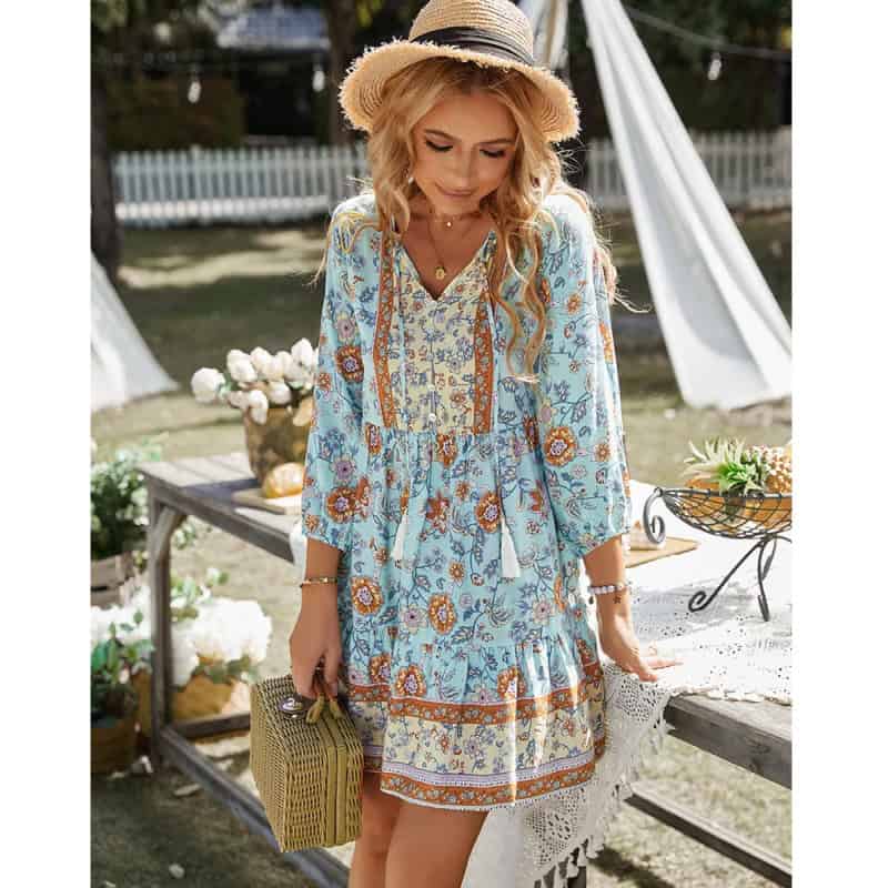 Beautiful bohemian summer dress with floral patterns, lightweight fabric, and relaxed fit perfect for outdoor occasions.
