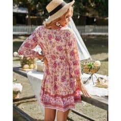 Stylish floral summer dress with vibrant pink and red patterns, perfect for outdoor gatherings and warm weather. Made from lightweight, breathable fabric for comfort and style.