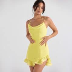 Bright yellow summer dress with ruffled hem for women. Perfect for casual outings, beach days, or parties. Comfortable, stylish, and ideal for warm weather occasions.