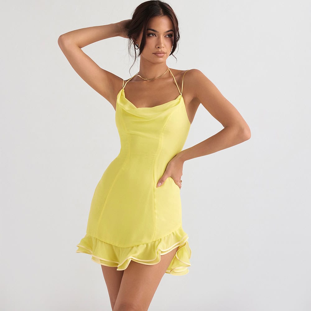 Elegant yellow satin dress with ruffled hemline, perfect for summer outings and party wear. Features delicate spaghetti straps and chic design for a stylish look.