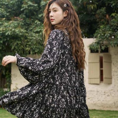 Stylish black floral dress with ruffled tiers, long sleeves, and a flowing silhouette, ideal for fashion-forward women seeking chic and versatile outfits from Monalisa Store.