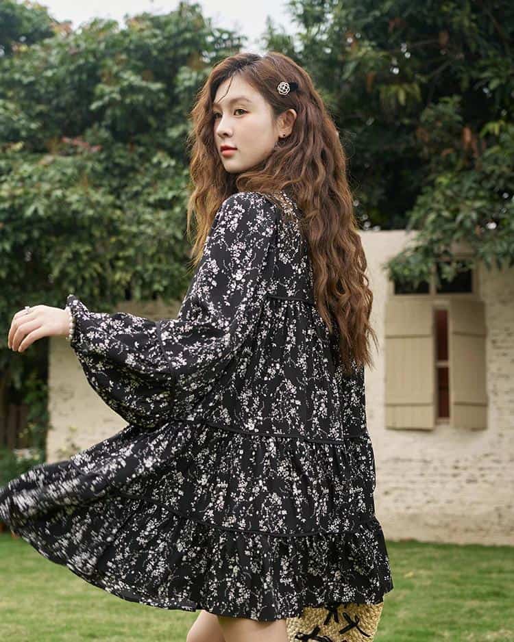 Stylish black floral dress with ruffled tiers, long sleeves, and a flowing silhouette, ideal for fashion-forward women seeking chic and versatile outfits from Monalisa Store.