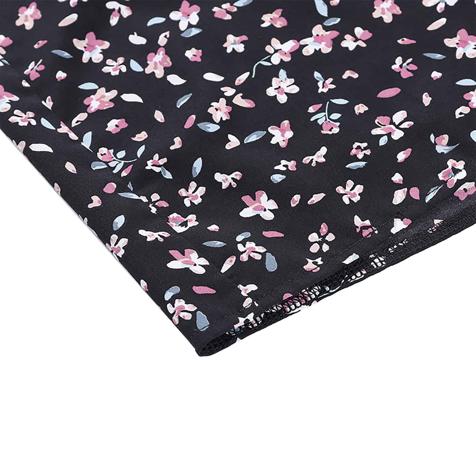 Bright, detailed fabric with pink, white, and blue flowers on a black background, ideal for making fashionable clothing items, accessories, or home decor.