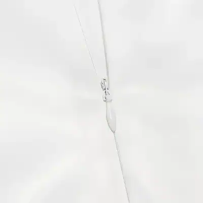 Close-up of a medical surgical needle and suture thread on sterile white background. Perfect for healthcare, medical, or surgical supplies, emphasizing precision and quality for ophthalmology or eye care.