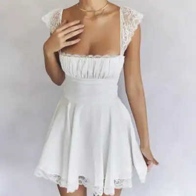 White women's dress featuring lace shoulder accents and a flowy skirt, perfect for summer or special occasions. Comfortable fit with stylish design.