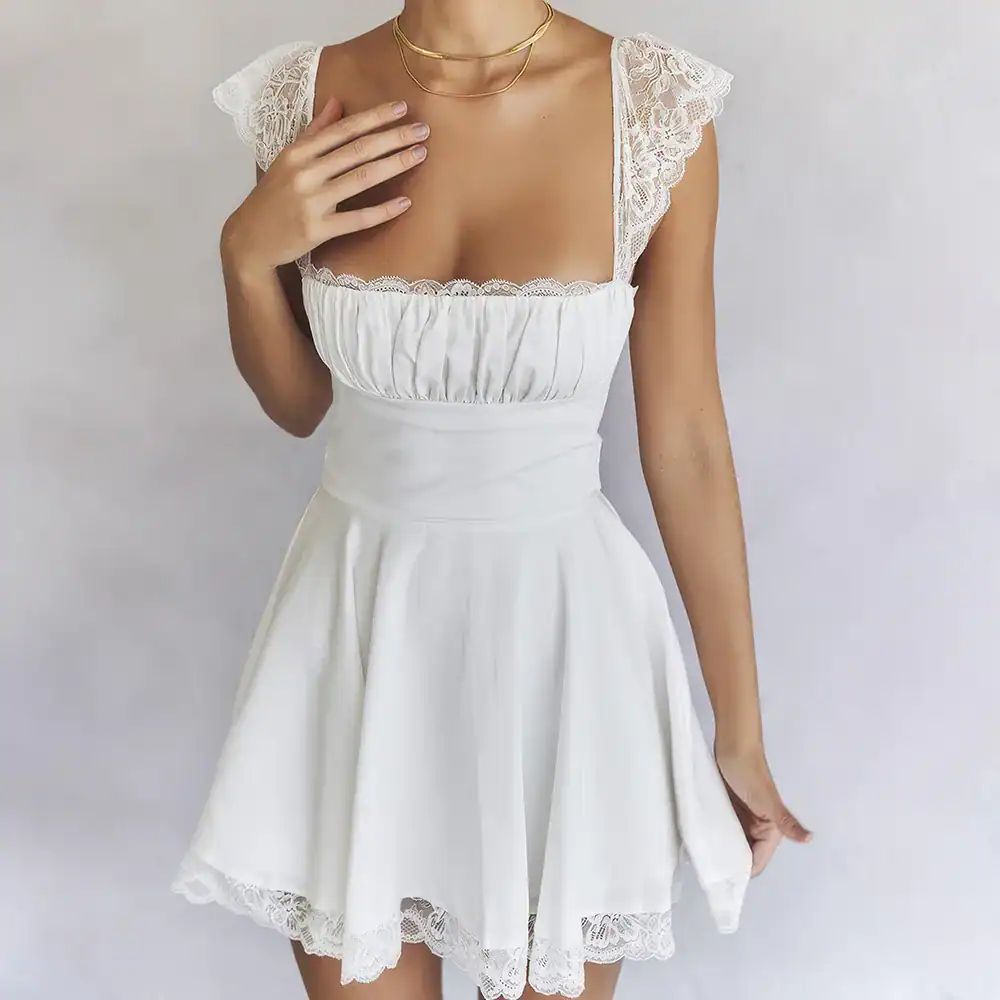 White women's dress featuring lace shoulder accents and a flowy skirt, perfect for summer or special occasions. Comfortable fit with stylish design.