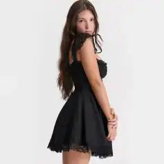 Stylish black lace dress with delicate lace details on sleeves and hem, perfect for special occasions, evening outings, or elegant events. Comfortable fit with a chic and timeless design.