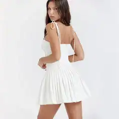 White pleated dress with adjustable shoulder straps, stylish and comfortable for women, ideal for summer outings.