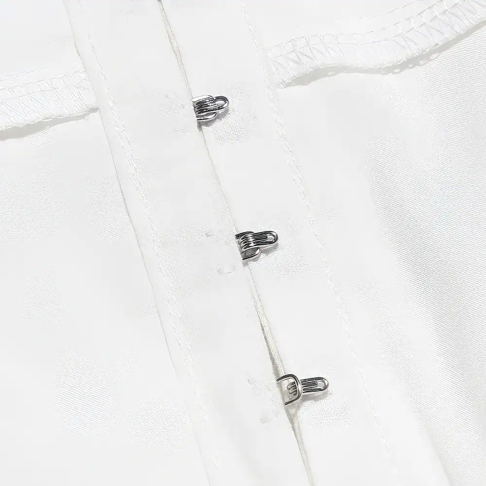 Hinged white storage case with metal clasps suitable for organizing and protecting optical lenses and accessories. Ideal for optometry clinics and eyewear retailers.