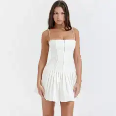 Stylish white dress featuring pleated skirt and spaghetti straps, perfect for fashion-forward women. Crafted with premium materials for a comfortable fit and trendy look in every season.