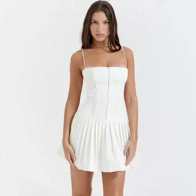 Stylish white dress featuring pleated skirt and spaghetti straps, perfect for fashion-forward women. Crafted with premium materials for a comfortable fit and trendy look in every season.