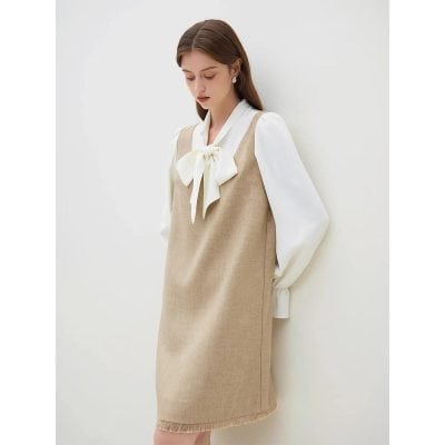 Stylish beige sleeveless dress paired with white blouse and bow tie, perfect for professional and casual wear at MonaLisa Medical Opt Store.