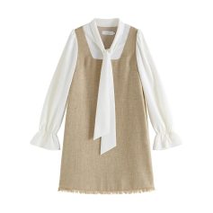 High-quality women's dress with a white blouse and beige vest, perfect for optometrists or eyewear store staff. Stylish, professional attire for optical retail environments.