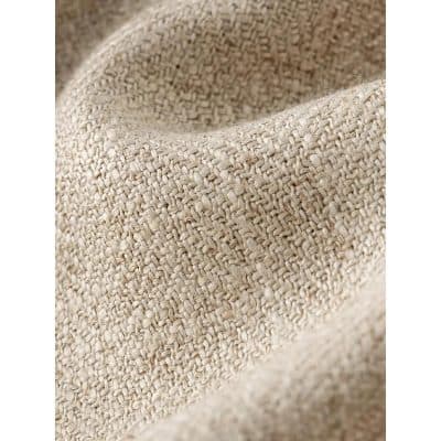 Close-up of woven beige fabric, highlighting textured material used for store decor or display accessories at Monalisa Store.