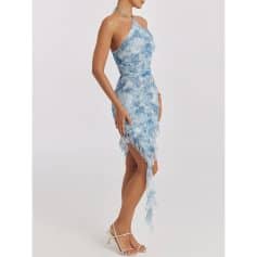 Stylish women’s blue tie-dye dress with ruffle detailing, perfect for casual or semi-formal occasions. Features a high slit and asymmetrical hemline, ensuring a chic and trendy look.