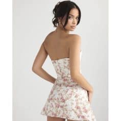 A stylish women's strapless dress featuring a delicate pink and white floral pattern, perfect for summer events, parties, or casual outings. Comfortable fit with a flattering silhouette.