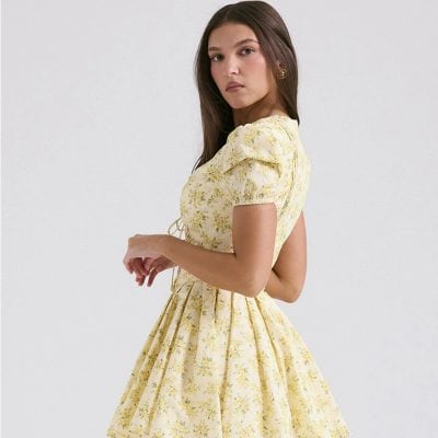 Stylish yellow floral dress with puff sleeves, perfect for casual or semi-formal occasions, emphasizing optimal comfort and fashion.