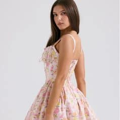 Elegant floral dress worn by a model, perfect for summer or spring fashion, showcasing trendy and stylish clothing from Monalisa Medical Store.