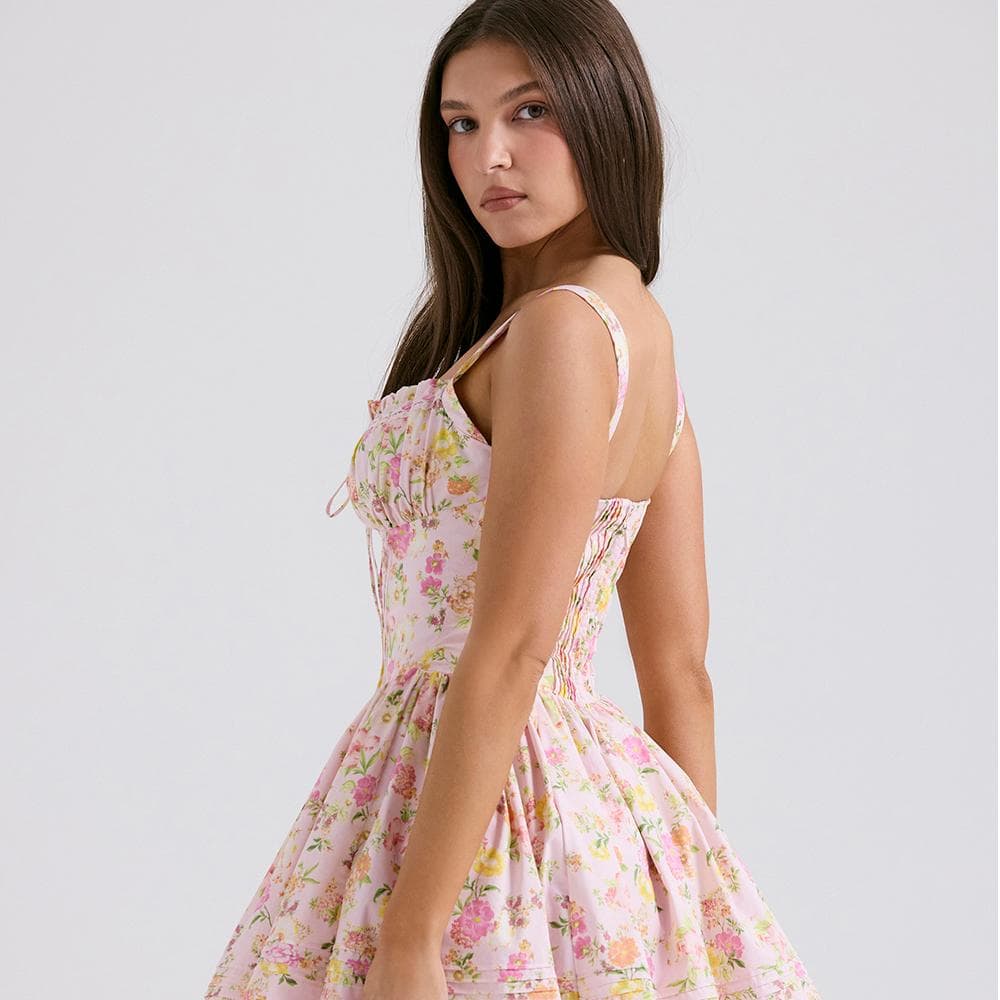 Elegant floral dress worn by a model, perfect for summer or spring fashion, showcasing trendy and stylish clothing from Monalisa Medical Store.