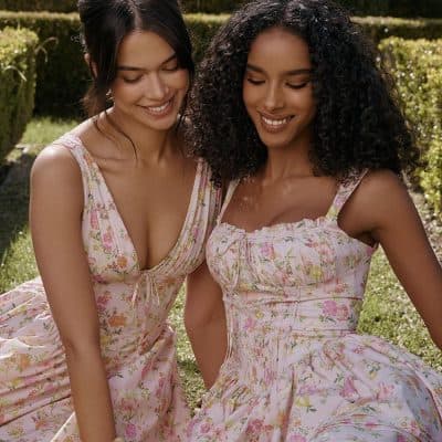 Beautiful women wearing floral dresses outdoors, showcasing stylish and comfortable clothing from Monalisa Store, perfect for spring and summer accessories and for enhancing your wardrobe.