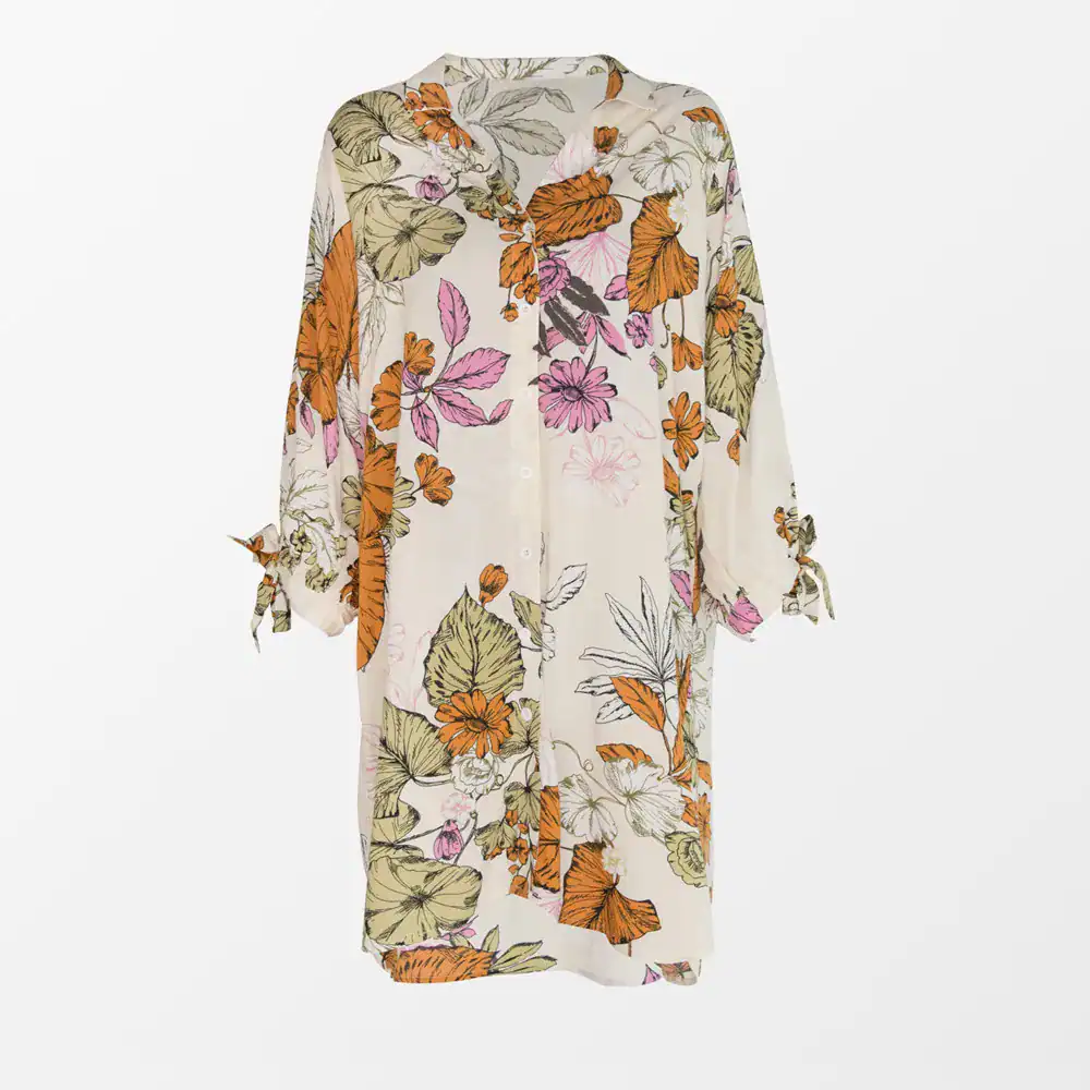 Women’s floral kaftan with vibrant orange, pink, and green botanical print, perfect for summer beach or casual wear, available at Monalisa Medical Store, your destination for stylish resort wear.