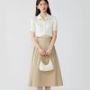 Stylish cream-colored handbag perfect for women's fashion accessories, casual or formal outfits, and shopping. Compatible with professional and everyday looks.