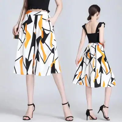 Stylish wide-leg pants with bold black, white, and orange abstract print, perfect for fashionable women. Comfortable fit with high waist and side pockets, ideal for casual or chic events.