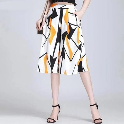 Women's wide-leg geometric patterned pants with black, yellow, and white abstract design. Perfect for stylish, modern fashion and casual or semi-formal occasions.