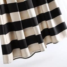 Black and white striped curtain for stylish window decor, offering modern elegance and light control, ideal for home or office spaces.