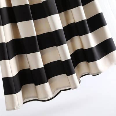 Black and white striped curtain for stylish window decor, offering modern elegance and light control, ideal for home or office spaces.