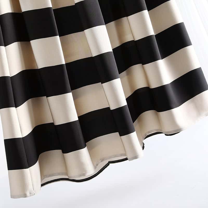 Black and white striped curtain for stylish window decor, offering modern elegance and light control, ideal for home or office spaces.