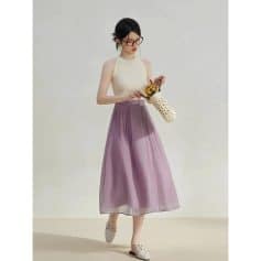 A stylish women's maxi skirt in a soft purple hue, perfect for casual and formal occasions with flowing fabric and comfortable fit.