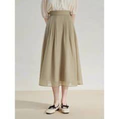 Stylish beige maxi skirt featuring a flowing, pleated design with a high waist, perfect for casual or formal occasions. Shop trendy women's fashion at Monalisa Store for versatile wardrobe essentials.