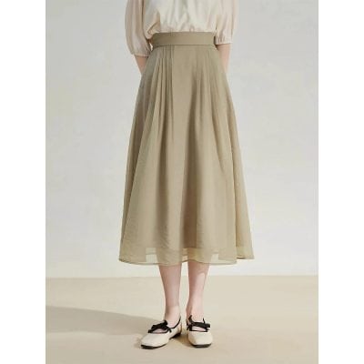Stylish beige maxi skirt featuring a flowing, pleated design with a high waist, perfect for casual or formal occasions. Shop trendy women's fashion at Monalisa Store for versatile wardrobe essentials.