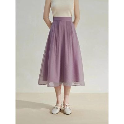 Luxurious lavender midi skirt featuring pleats and sheer overlay, perfect for stylish occasions and office wear. Crafted with high-quality fabric for comfort and elegance.