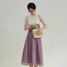Chic women's outfit featuring a flowy purple maxi skirt and sleeveless top, ideal for fashionable summer looks, casual day out, or shopping trips.