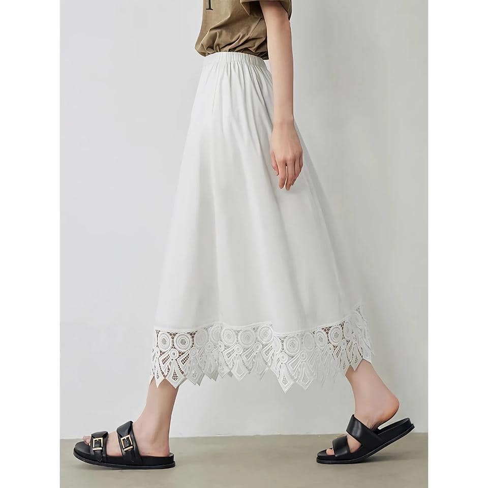 High-quality white skirt with intricate lace hem, perfect for summer fashion and casual outings. Comfortable and stylish, ideal for women seeking a blend of elegance and ease.