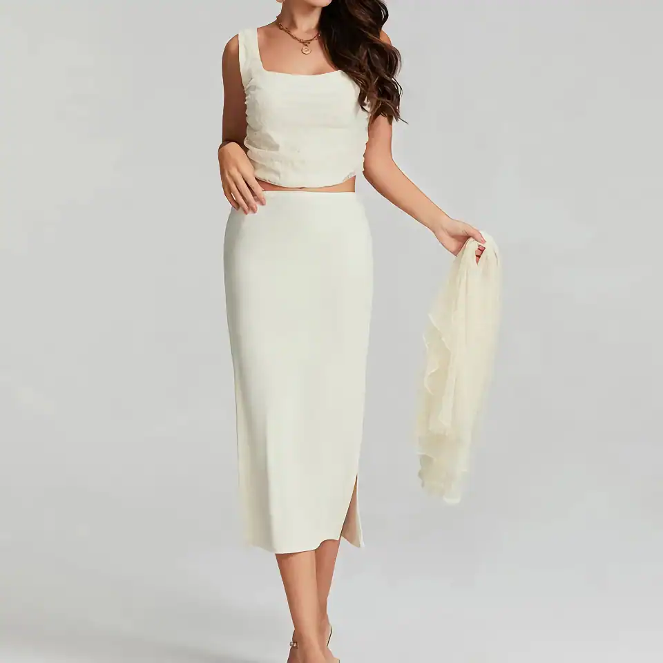 Luxurious ivory silk midi skirt for women, perfect for formal occasions and stylish fashion. Comfortable fit with a subtle side slit, showcasing timeless elegance and premium quality. Ideal for weddings or special events.