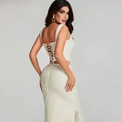 Stylish white lace dress with detailed back lacing, perfect for formal occasions and special events. High-quality fabric, trendy design, and comfortable fit for a sophisticated look.