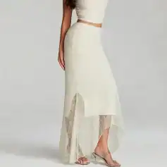 Lace maxi skirt with high slit, perfect for stylish summer outfits and special occasions. Features delicate lace details and a flowing silhouette for a chic, feminine look.