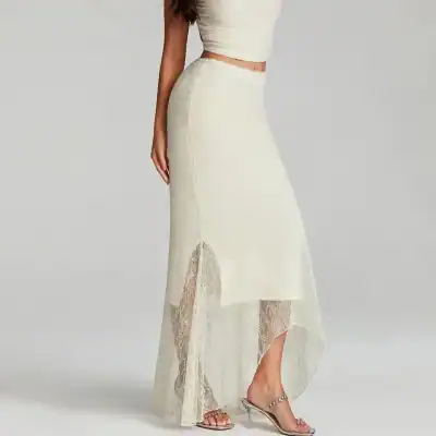 Lace maxi skirt with high slit, perfect for stylish summer outfits and special occasions. Features delicate lace details and a flowing silhouette for a chic, feminine look.