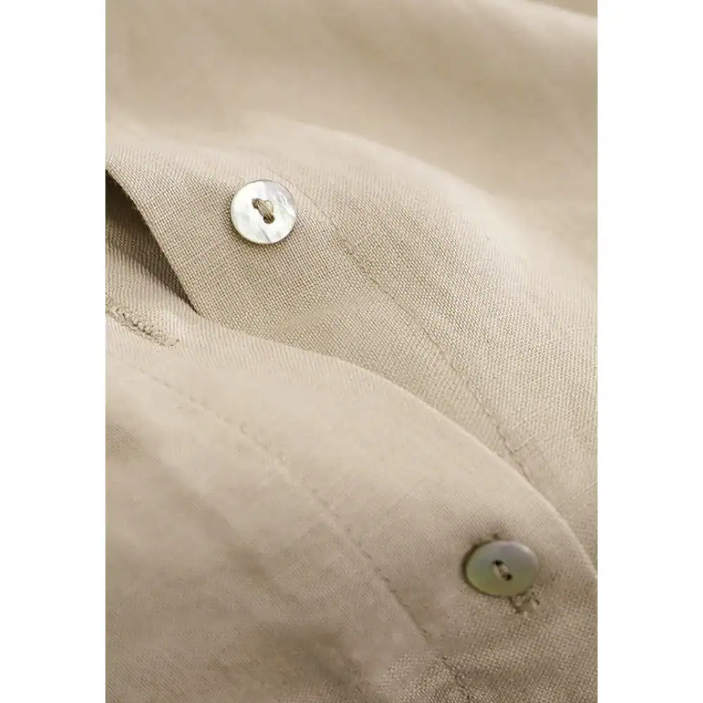 Light beige, tailored dress shirt with pearl buttons, perfect for professional or formal occasions. Excellent quality, stylish, and comfortable for men seeking refined eyewear and fashion accessories.